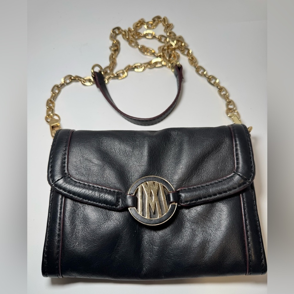 Antonio Melani black leather crossbody bag with a gold chain strap